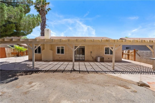 4633 Dowel Ave, Palmdale, CA 93552 - back of property featuring a patio, a chimney, a pergola, and stucco siding