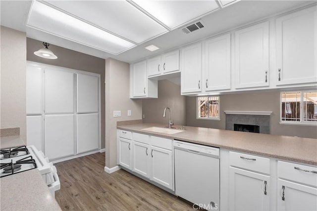 4633 Dowel Ave, Palmdale, CA 93552 - kitchen featuring white appliances, light wood-style flooring, white cabinets, and light countertops