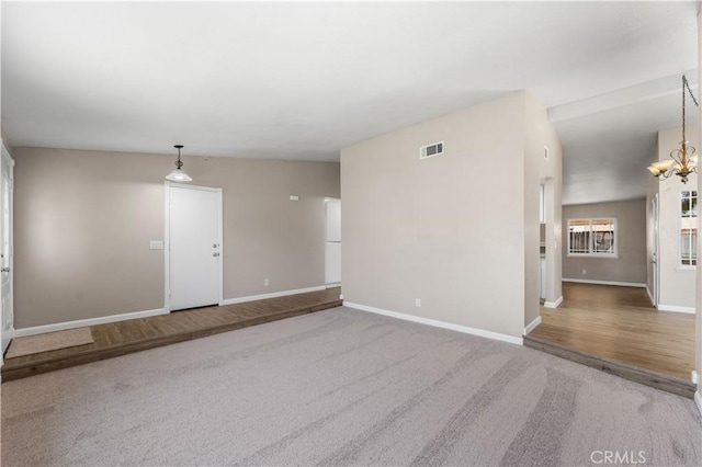 4633 Dowel Ave, Palmdale, CA 93552 - empty room featuring carpet and a chandelier