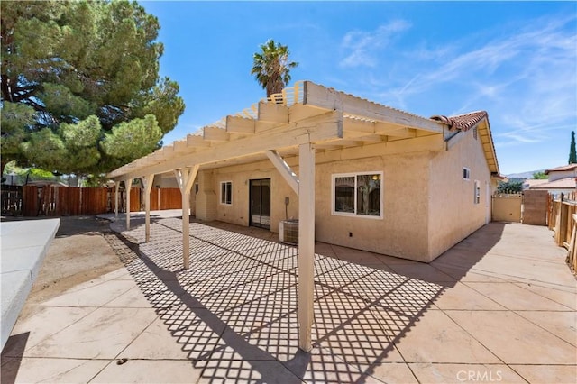 4633 Dowel Ave, Palmdale, CA 93552 - back of property featuring stucco siding, a patio, and a pergola