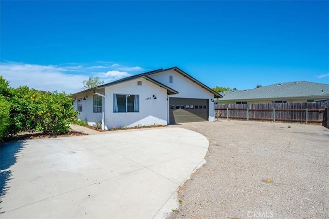 1066 Maple St, Arroyo Grande, CA 93420 - back of house with concrete driveway, stucco siding, and an attached garage