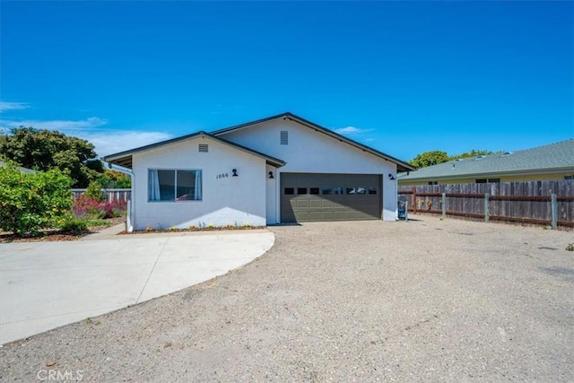 1066 Maple St, Arroyo Grande, CA 93420 - view of front of home with a garage, stucco siding, and concrete driveway