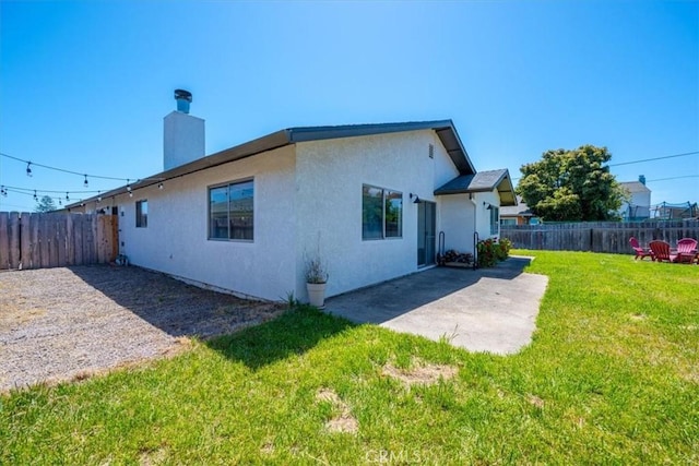 1066 Maple St, Arroyo Grande, CA 93420 - back of house with stucco siding, a fenced backyard, a patio, and a chimney