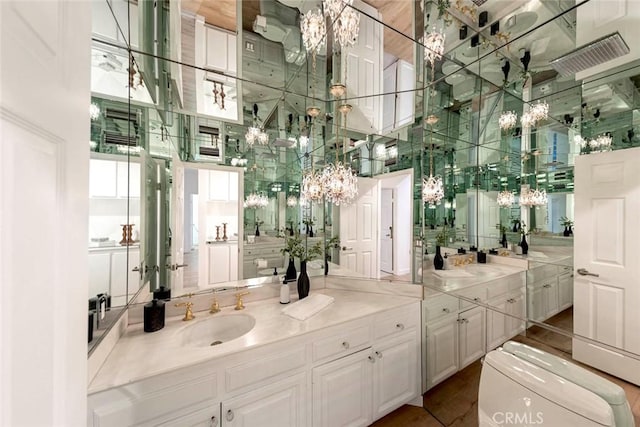 11 Montpellier Unit 22, Newport Beach, CA 92660 - bathroom with a high ceiling, a chandelier, and vanity
