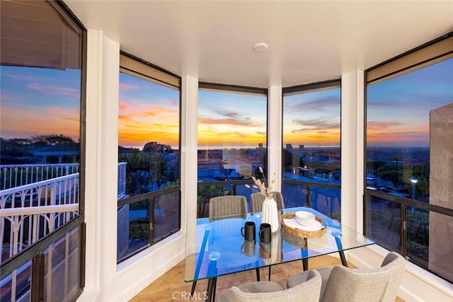 11 Montpellier Unit 22, Newport Beach, CA 92660 - sunroom / solarium featuring floor to ceiling windows and wood finished floors