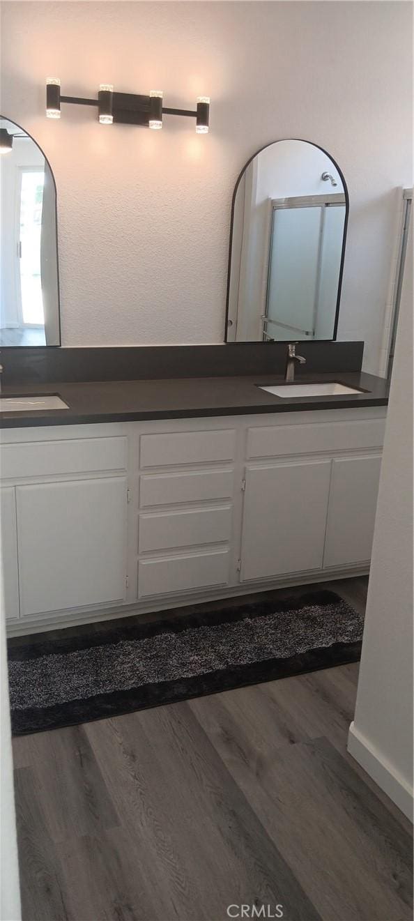720 Big Spring Dr, Banning, CA 92220 - bathroom with double vanity and wood finished floors