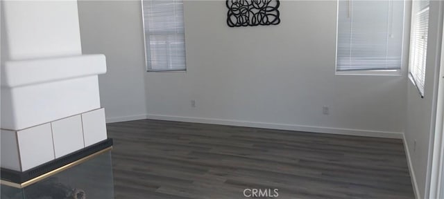 720 Big Spring Dr, Banning, CA 92220 - empty room with dark wood-type flooring and baseboards