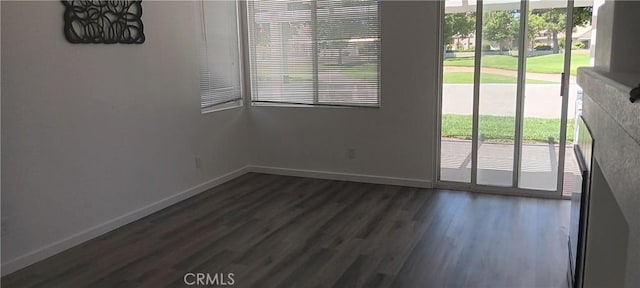 720 Big Spring Dr, Banning, CA 92220 - unfurnished dining area featuring dark wood finished floors and baseboards