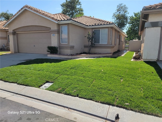 720 Big Spring Dr, Banning, CA 92220 - view of front of house with stucco siding, a tiled roof, a garage, and concrete driveway