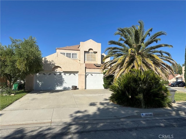 38830 Calistoga St, Palmdale, CA 93551 - mediterranean / spanish-style house featuring stucco siding, driveway, and an attached garage