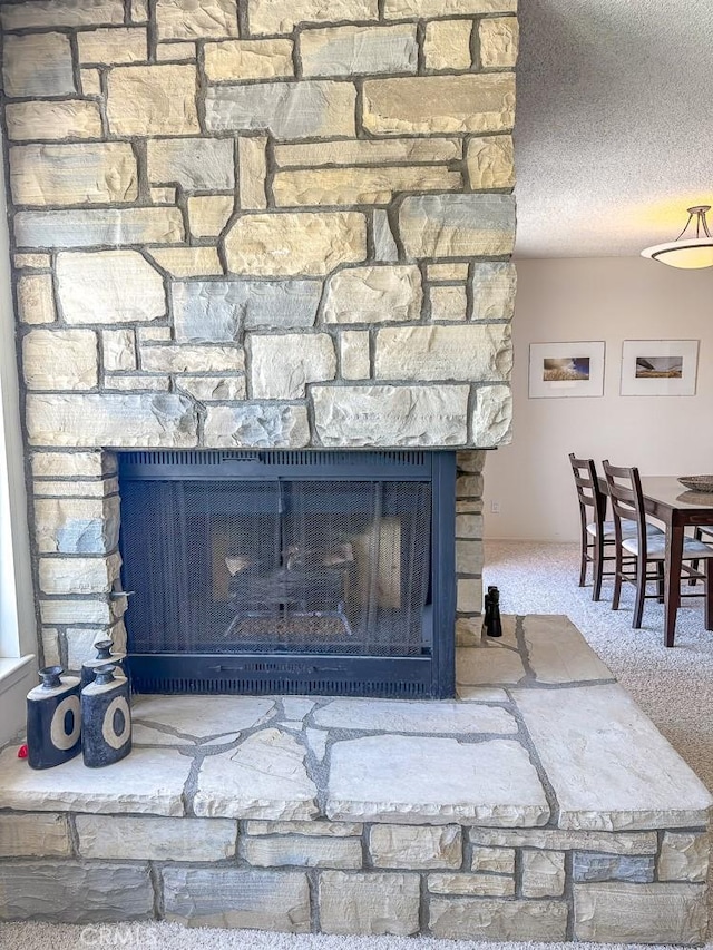 557 Lucerne St, Cayucos, CA 93430 - detailed view of a stone fireplace and carpet floors