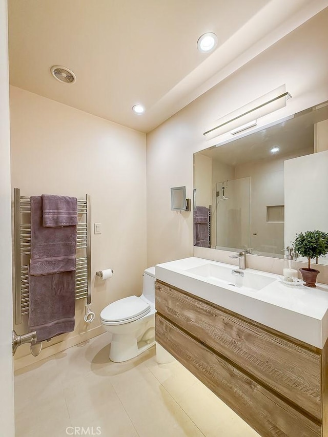 557 Lucerne St, Cayucos, CA 93430 - bathroom with a towel warmer, vanity, tile patterned flooring, recessed lighting, and a shower