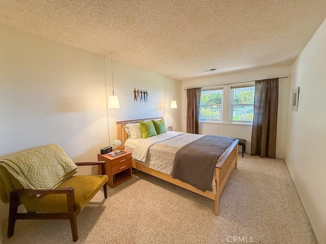 557 Lucerne St, Cayucos, CA 93430 - bedroom with light colored carpet and a textured ceiling