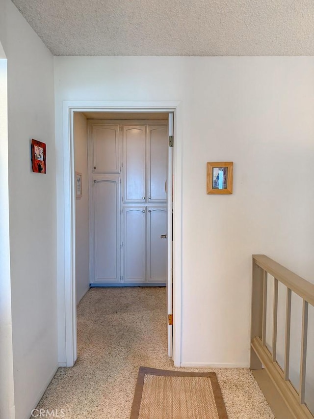 557 Lucerne St, Cayucos, CA 93430 - corridor with light carpet and a textured ceiling