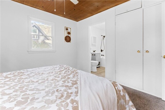 1777 Sparrow Rd, Wrightwood, CA 92397 - carpeted bedroom with wooden ceiling and connected bathroom