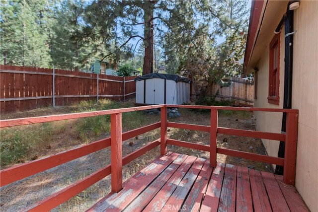 1777 Sparrow Rd, Wrightwood, CA 92397 - wooden terrace with a storage shed and a fenced backyard