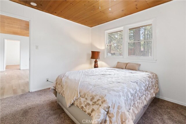 1777 Sparrow Rd, Wrightwood, CA 92397 - carpeted bedroom featuring wooden ceiling and baseboards