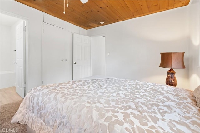 1777 Sparrow Rd, Wrightwood, CA 92397 - bedroom featuring wooden ceiling, ensuite bathroom, and carpet flooring