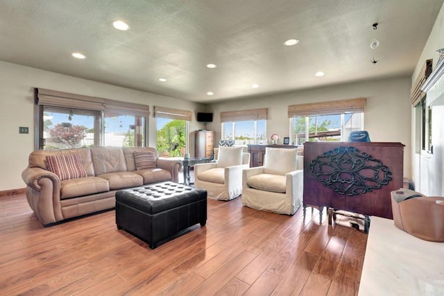 90 E Emerson St, Chula Vista, CA 91911 - living area featuring recessed lighting, wood finished floors, plenty of natural light, and a textured ceiling