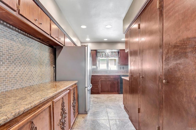 90 E Emerson St, Chula Vista, CA 91911 - kitchen with freestanding refrigerator, tasteful backsplash, recessed lighting, light stone counters, and dishwashing machine