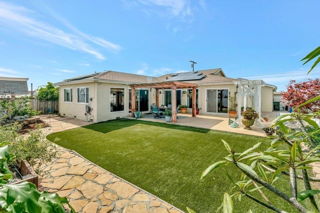 90 E Emerson St, Chula Vista, CA 91911 - back of house with a pergola, stucco siding, a fenced backyard, a patio, and solar panels