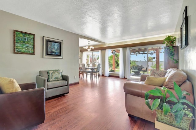 90 E Emerson St, Chula Vista, CA 91911 - living room with a chandelier, plenty of natural light, wood finished floors, and a textured ceiling