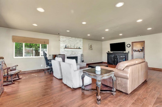90 E Emerson St, Chula Vista, CA 91911 - living room featuring a stone fireplace, wood finished floors, and recessed lighting