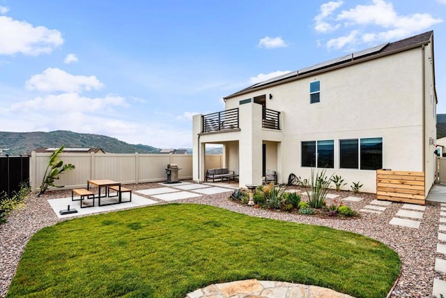 35188 Orchard Trl, Fallbrook, CA 92028 - back of property featuring a balcony, stucco siding, a fenced backyard, a patio, and a mountain view