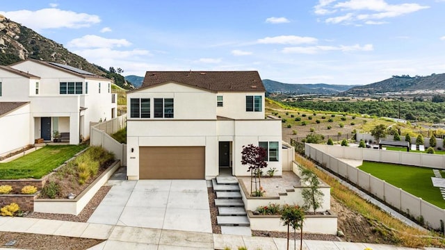 35188 Orchard Trl, Fallbrook, CA 92028 - modern home with a mountain view, concrete driveway, a garage, and stucco siding