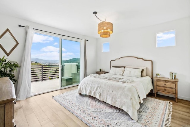 35188 Orchard Trl, Fallbrook, CA 92028 - bedroom featuring access to exterior, wood finished floors, a chandelier, and a mountain view