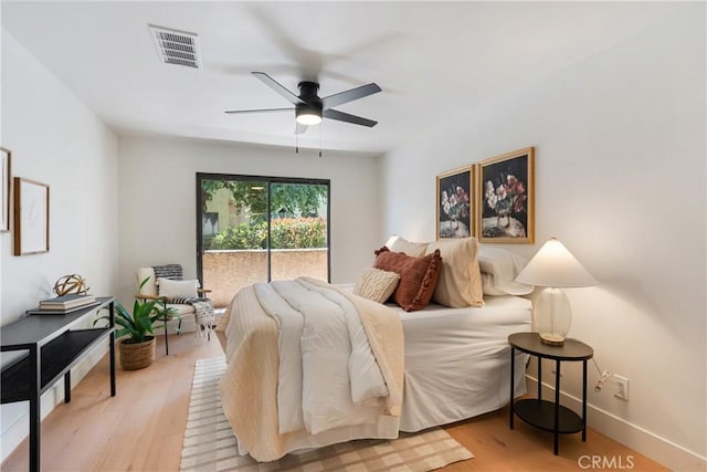 25564 Sharp Dr Unit G, Hemet, CA 92544 - bedroom with light wood-type flooring, access to exterior, and ceiling fan