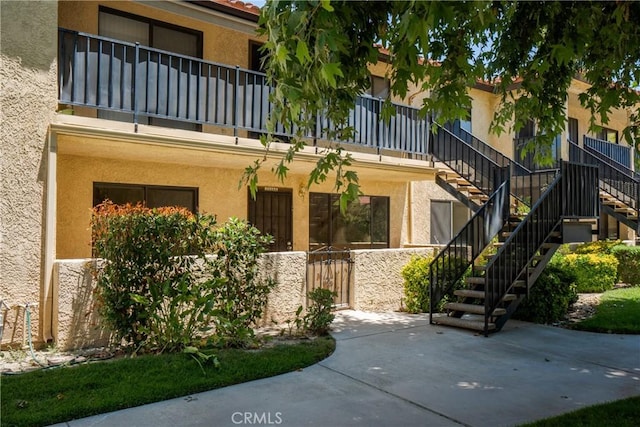 25564 Sharp Dr Unit G, Hemet, CA 92544 - doorway to property with a balcony and stucco siding