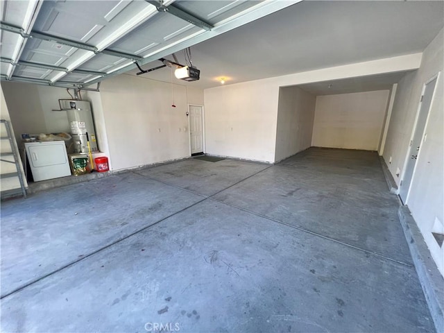 3642 Neola Way, Lancaster, CA 93536 - garage with strapped water heater, a garage door opener, and independent washer and dryer