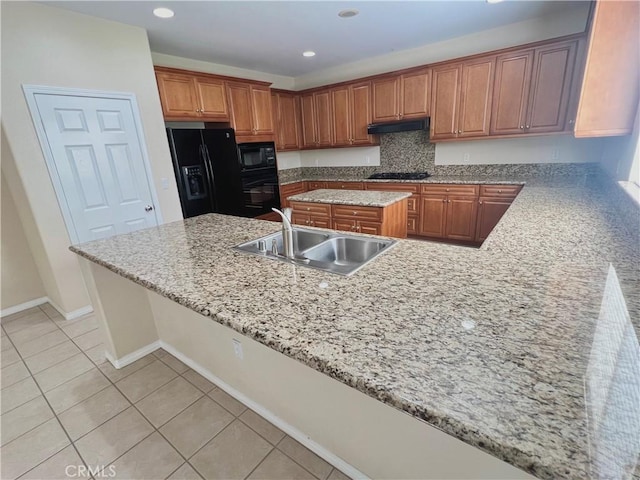 3642 Neola Way, Lancaster, CA 93536 - kitchen featuring black appliances, under cabinet range hood, brown cabinets, a kitchen island, and recessed lighting