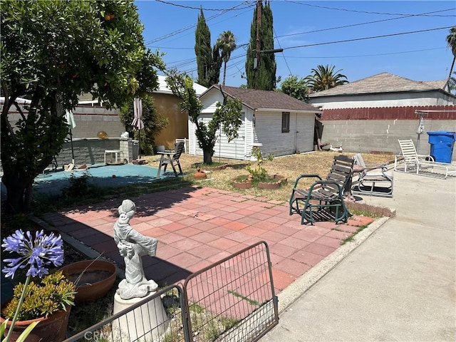 4830 Sancola Ave, North Hollywood, CA 91601 - fenced backyard with a patio and an outbuilding