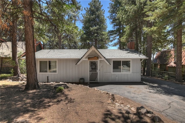 31449 Onacrest Dr, Running Springs, CA 92382 - view of front of property with a chimney, board and batten siding, and a shingled roof