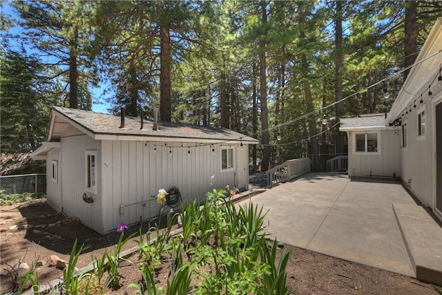 31449 Onacrest Dr, Running Springs, CA 92382 - exterior space with a patio and a shingled roof