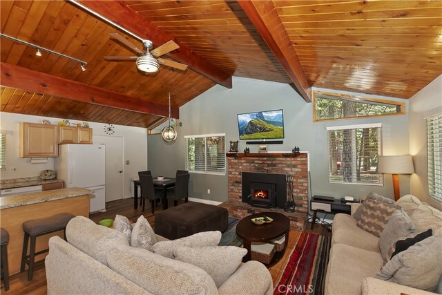 31449 Onacrest Dr, Running Springs, CA 92382 - living area with dark wood-type flooring, wooden ceiling, track lighting, ceiling fan, and a brick fireplace