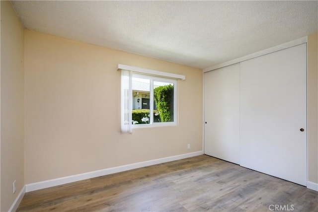 1881 Mitchell Ave Unit 8, Tustin, CA 92780 - empty room featuring wood finished floors and a textured ceiling