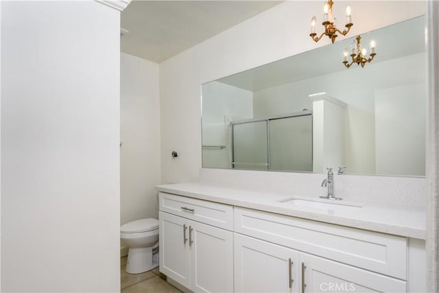 1881 Mitchell Ave Unit 8, Tustin, CA 92780 - full bath with a chandelier, vanity, a shower with shower door, and tile patterned flooring