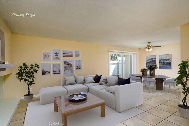 1881 Mitchell Ave Unit 8, Tustin, CA 92780 - living room with light tile patterned floors and ceiling fan