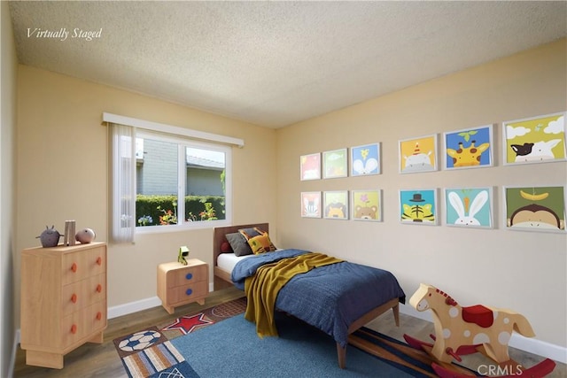 1881 Mitchell Ave Unit 8, Tustin, CA 92780 - bedroom with a textured ceiling and wood finished floors
