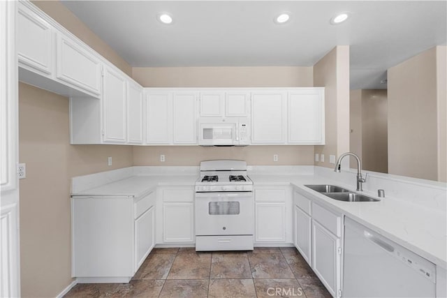 38181 Silver Ct, Palmdale, CA 93552 - kitchen with white appliances, light countertops, white cabinetry, and recessed lighting