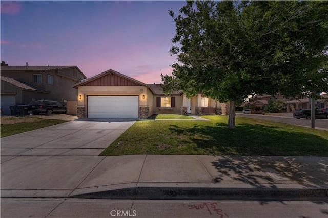 38181 Silver Ct, Palmdale, CA 93552 - single story home with an attached garage, a yard, concrete driveway, stucco siding, and stone siding