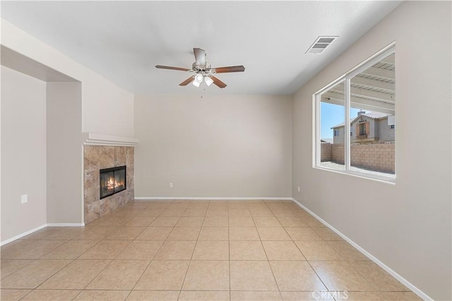 38181 Silver Ct, Palmdale, CA 93552 - unfurnished living room with a ceiling fan, a tile fireplace, and light tile patterned flooring
