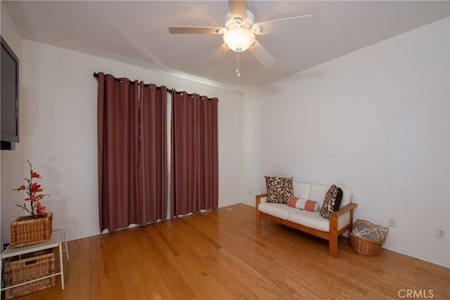 29427 Bentcreek Ct, Menifee, CA 92584 - sitting room featuring wood finished floors and a ceiling fan