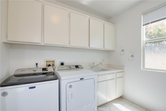 29427 Bentcreek Ct, Menifee, CA 92584 - laundry area featuring separate washer and dryer, cabinet space, and light tile patterned floors