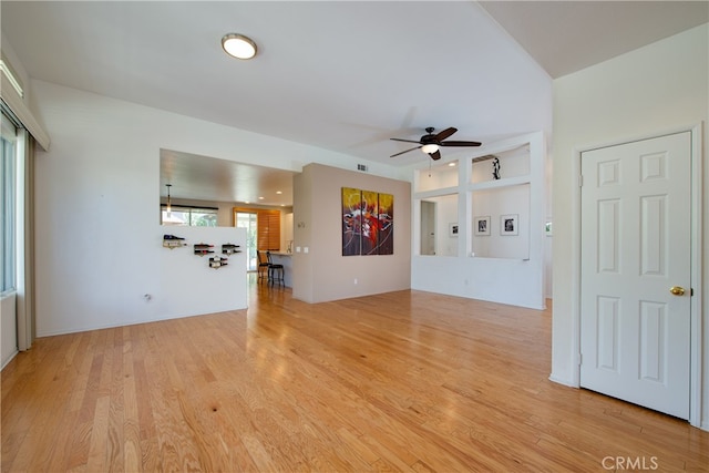 29427 Bentcreek Ct, Menifee, CA 92584 - unfurnished living room featuring ceiling fan and wood finished floors