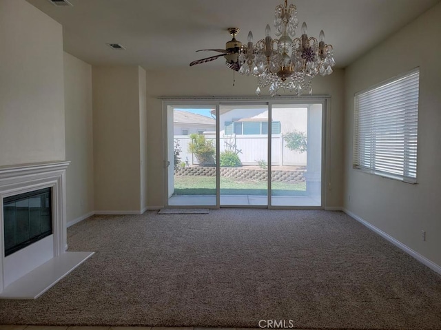 11142 Avonlea Rd, Apple Valley, CA 92308 - unfurnished living room with carpet, plenty of natural light, a glass covered fireplace, and a chandelier