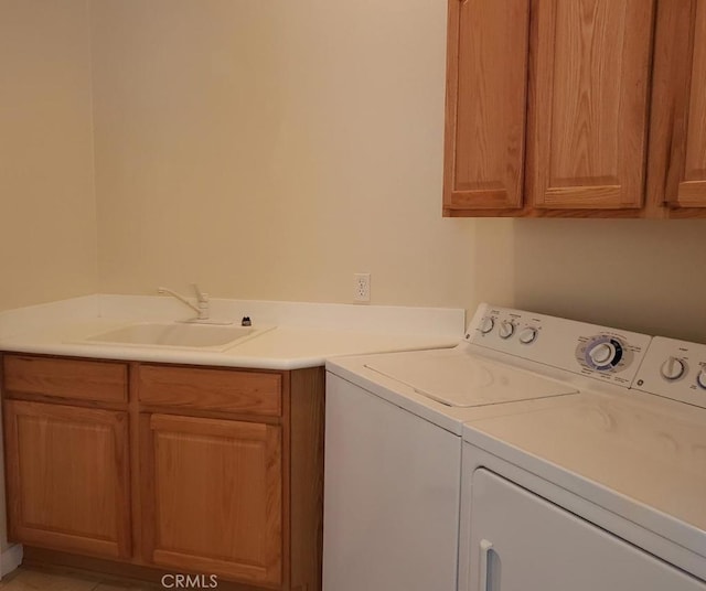 11142 Avonlea Rd, Apple Valley, CA 92308 - laundry area featuring cabinet space and washing machine and dryer